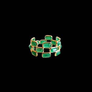 May include: A gold ring with a band of emerald green rectangular stones.