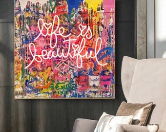 May include: A colorful abstract painting with a pink neon sign that says "life is beautiful" on a background of graffiti and paint splatters.