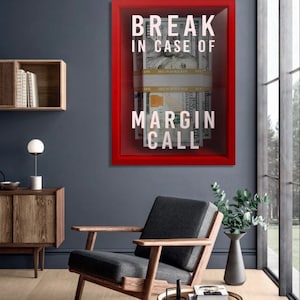 May include: A red fire alarm box with the text "Break in case of Margin Call" and stacks of US dollar bills inside.