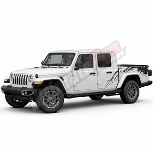 May include: White Jeep Gladiator pickup truck with black mud-splatter graphics on the sides. The truck has a black grille and black wheels.