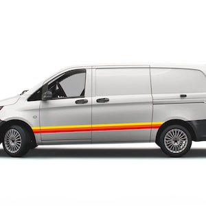May include: A white van with a yellow and red stripe along the side. The van has a sliding door on the passenger side and a rear door.