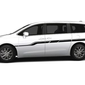 May include: White minivan with black side stripes. The stripes are a combination of straight and curved lines.