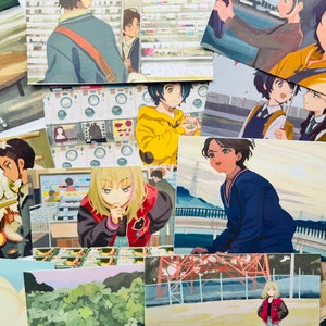 May include: A collection of colorful anime-style illustrations printed on cards. The illustrations feature characters with different hairstyles, clothing, and expressions. Some of the cards have a background of a city street, a bridge, or a store.