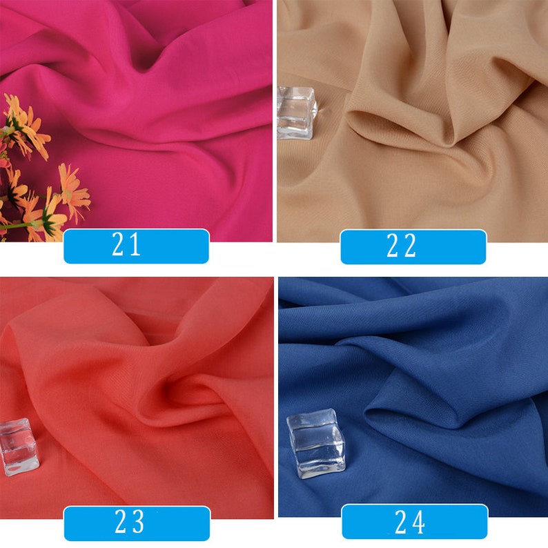 May include: Four fabric swatches in different colors: fuchsia, beige, coral, and blue. Each swatch is labeled with a number: 21, 22, 23, and 24.