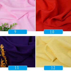 May include: Four fabric swatches in different colors: pink, red, purple, and yellow. The swatches are labeled with numbers 9, 10, 11, and 12.