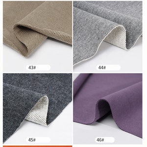 May include: A collection of fabric swatches in various colors, including brown, gray, purple, and orange. Each swatch is folded in half to show the inside and outside of the fabric. The swatches are labeled with numbers 41 through 47.