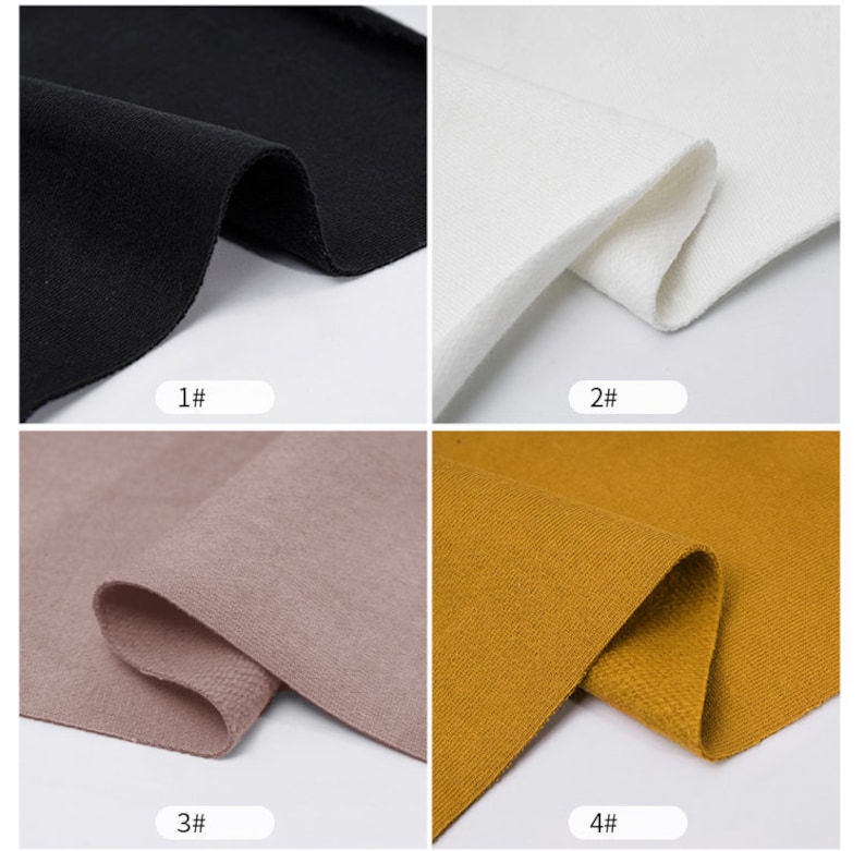 May include: Four fabric swatches in different colors: black, white, light brown, and mustard yellow. The fabric is a soft, textured knit.