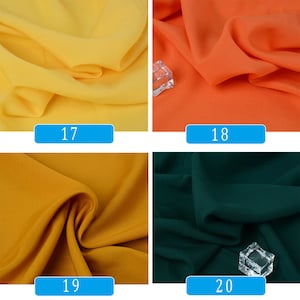 May include: Four fabric swatches in different colors: yellow, orange, mustard yellow, and dark green. The swatches are labeled with numbers 17, 18, 19, and 20.