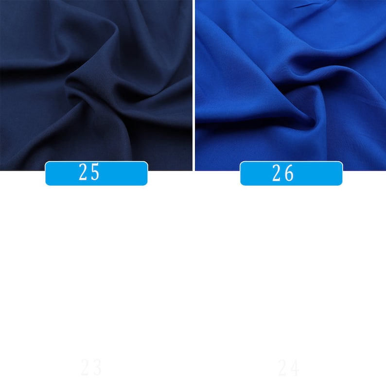 May include: Two fabric swatches, one dark blue and one royal blue. The swatches are folded and the fabric has a smooth texture.