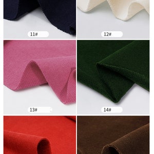 May include: Six fabric swatches in different colors. The swatches are arranged in two rows of three. The colors are navy blue, white, pink, green, red, and brown.