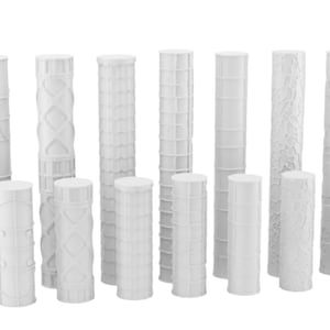 May include: A selection of white, cylindrical objects with diverse textured designs. Some have geometric patterns, while others feature vertical lines or a textured surface. The objects vary in height and diameter.