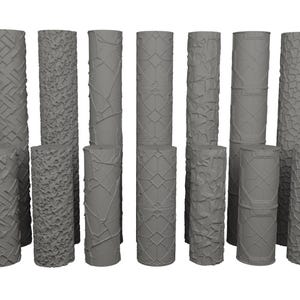 May include: A selection of grey cylindrical objects featuring diverse textured patterns. The designs include geometric shapes, woven textures, and organic patterns. The cylinders vary in height and diameter, and are arranged in a group.