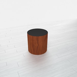 May include: A wooden pedestal with a black top. The pedestal is made of a dark wood with a natural grain pattern.