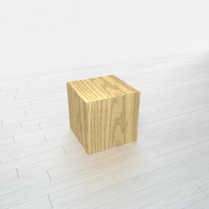 May include: A light brown wooden cube, perfect for displaying small items or as a decorative accent.