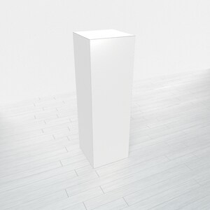 May include: A white, rectangular pedestal or display stand. The stand is tall and narrow, with a smooth, flat surface.