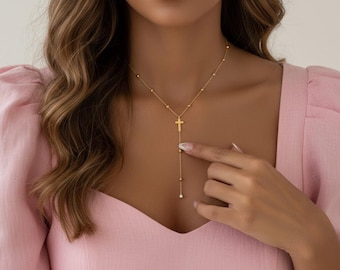 Y-shaped beaded necklace with cross pendant and cubic zirconia, made of 18K gold-plated stainless steel, waterproof.