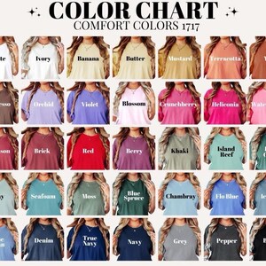 May include: Color chart featuring a variety of Comfort Colors t-shirts. The chart displays a range of colors, including white, ivory, banana, and black. The text "COLOR CHART COMFORT COLORS 1717" is at the top.