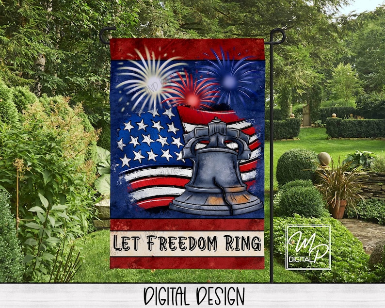 May include: A patriotic garden flag featuring the Liberty Bell, American flag, and fireworks against a blue background. The flag has the text "LET FREEDOM RING" and "DIGITAL DESIGN". The flag is displayed in a garden setting.