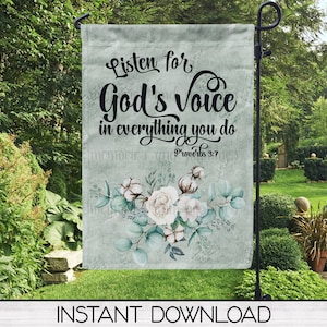 May include: A teal blue garden flag with a white floral design and the text "Listen for God's Voice in everything you do Proverbs 3:7".