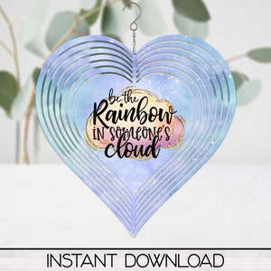 May include: A heart-shaped metal wind chime with a watercolor-style design of a cloud with the text "be the rainbow in someone's cloud".