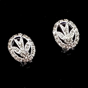 Pendientes vintage con clip de pedrería en tono plateado de los años 50