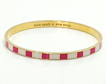 Signed Kate Spade Gold Tone Pink and White Enamel Bangle Bracelet "Hit Your Stride"  Minimalist