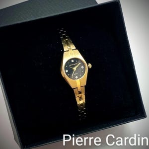 Vintage Pierre Cardin Gold Tone Watch: Black Face Crystal Accents, 5 3/4 Inch