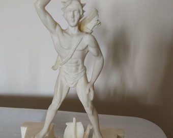 A large statuette of the Colossus of Rhodes,a statue of the sun god Helios,a statuette made of alabaster