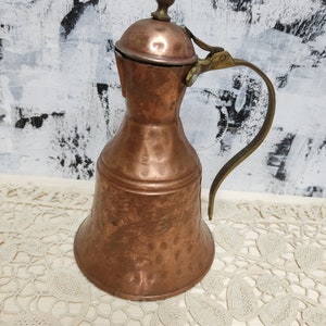 Copper forged traditional Greek jug, Copper vessel.Copper dishes