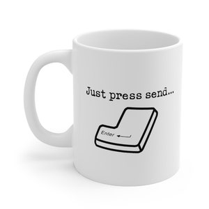 May include: White ceramic mug with a black design of a computer key with the word "Enter" and the text "Just press send..."