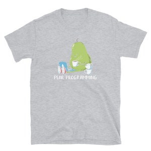 May include: A gray t-shirt with a green pear illustration holding a laptop and a cup of coffee. The text "PEAR PROGRAMMING" is printed below the pear.