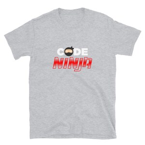 May include: A gray t-shirt with the text "CODE NINJA" in white and red letters. A cartoon ninja face is above the word "CODE".
