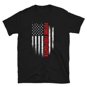 May include: Black t-shirt with a distressed American flag design and the text "FUTURE FIREFIGHTER" in red.