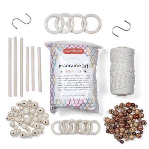 May include: A macrame kit with 120 pieces, including natural cotton rope, wooden rings, beads, and sticks. The kit also includes instructions and two silver hooks. The kit is packaged in a clear plastic bag with a colorful design.
