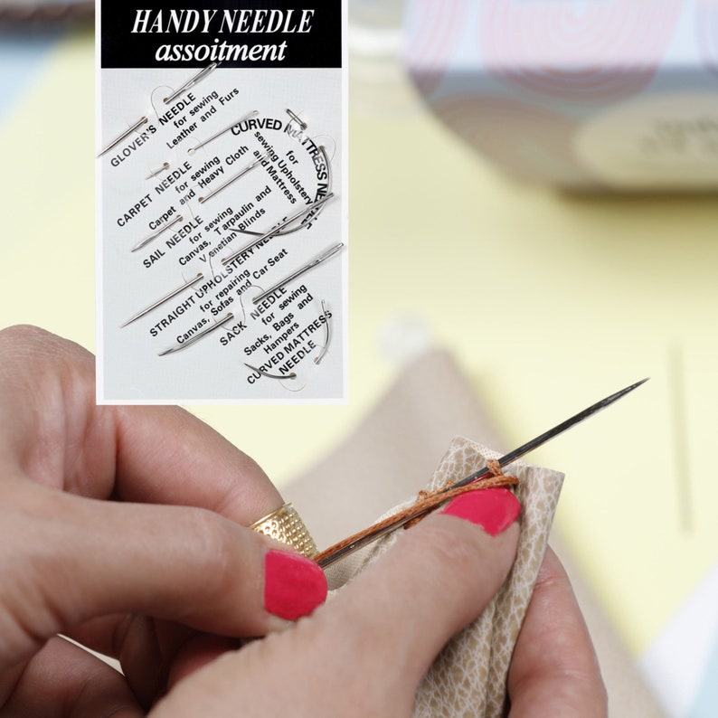 May include: A close-up of a hand using a needle to sew a brown leather material. A card with a variety of needles and their uses is visible in the background. The card reads "HANDY NEEDLE assoitment" and lists different types of needles, including "GLOVER'S NEEDLE", "CARPET NEEDLE", "SAIL NEEDLE", "STRAIGHT UPHOLSTERY NEEDLE", "SACK NEEDLE", and "CURVED MATTRESS NEEDLE".