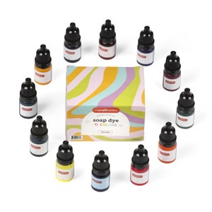 May include: A set of 12 soap dye bottles in various colors, arranged in a circle around a box labeled "incraftables soap dye 12 COLORS 3ml each".