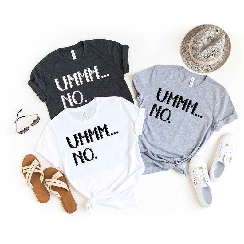 May include: Three t-shirts with the text "UMMM... NO." printed on them. The shirts are in white, grey, and dark grey.