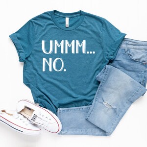 May include: A teal blue t-shirt with the text "UMMM... NO." in white.