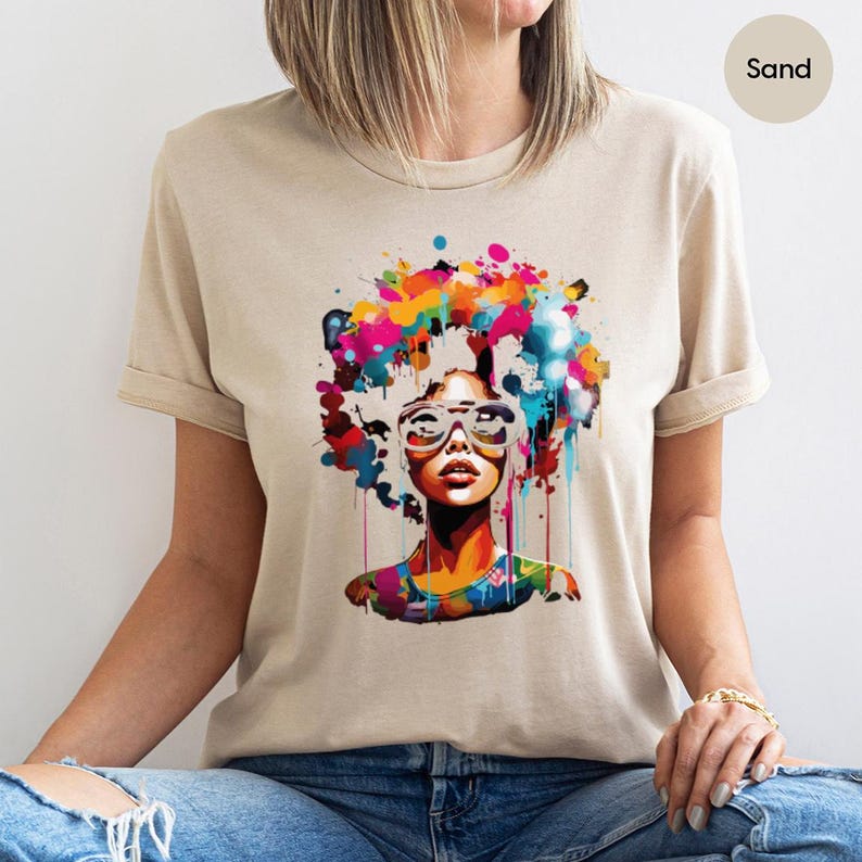 a woman wearing a t - shirt with a picture of a woman's face