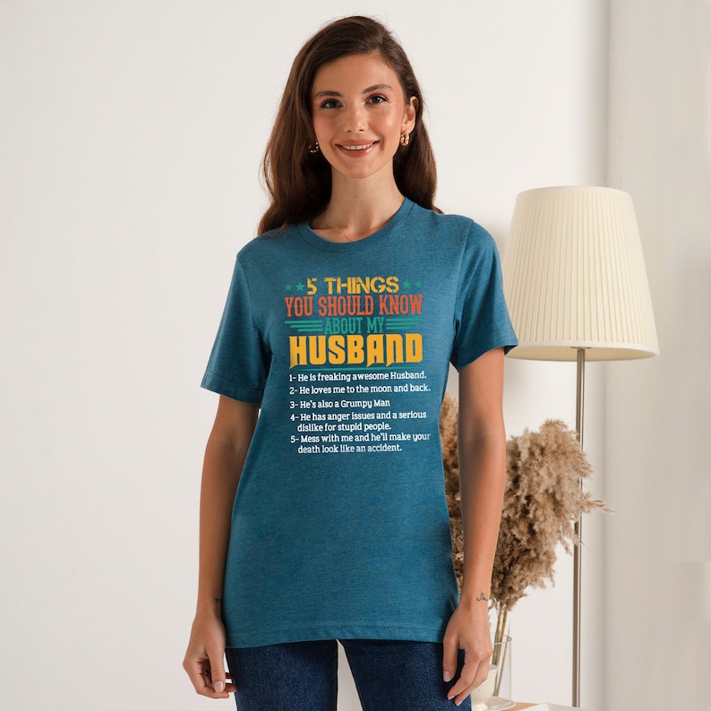 May include: A teal blue t-shirt with a white graphic print that says "5 Things You Should Know About My Husband" with a list of five humorous statements about husbands.