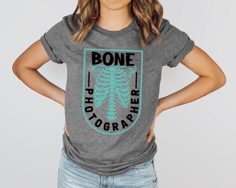 a woman wearing a t - shirt with a skeleton on it