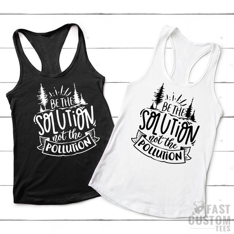 May include: Two tank tops with a black and white design. The design features a stylized tree with the text "BE THE SOLUTION not the POLLUTION".