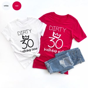 May include: Two t-shirts, one white and one red, with the text "Dirty 30" and a crown above the number. The white shirt says "birthday crew" and the red shirt says "birthday girl".