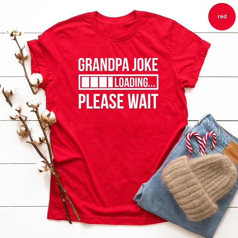 May include: Red t-shirt with white text that reads "Grandpa Joke Loading... Please Wait".