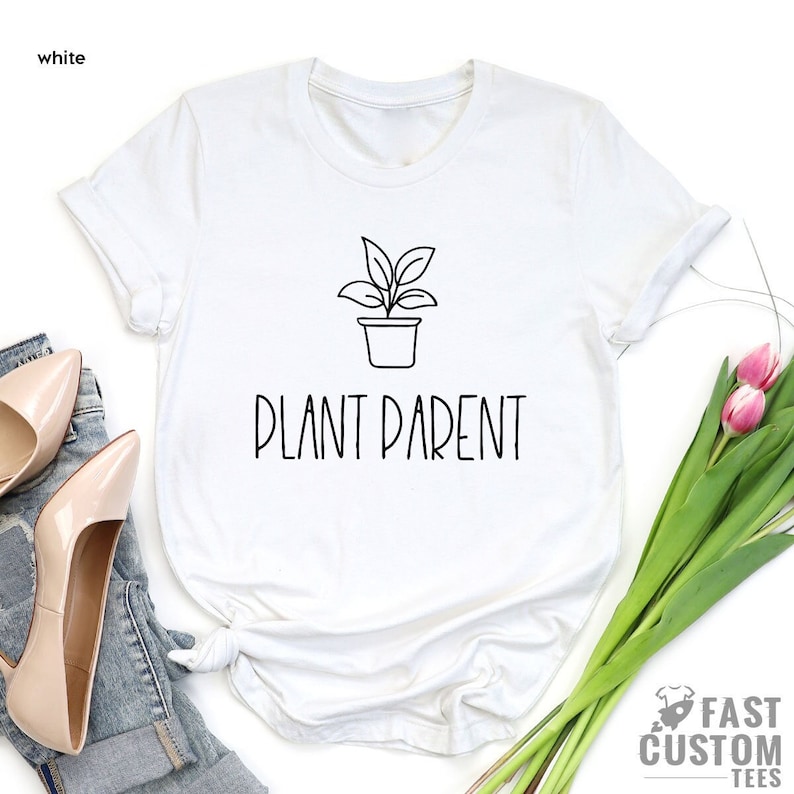 May include: White t-shirt with a black line drawing of a potted plant and the text "Plant Parent" printed on the front.