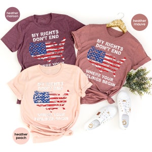 May include: Three heather t-shirts in maroon, mauve, and peach. Each shirt features a distressed American flag design in the shape of the United States, with the text "MY RIGHTS DON'T END" and "WHERE YOUR FEELINGS BEGIN".
