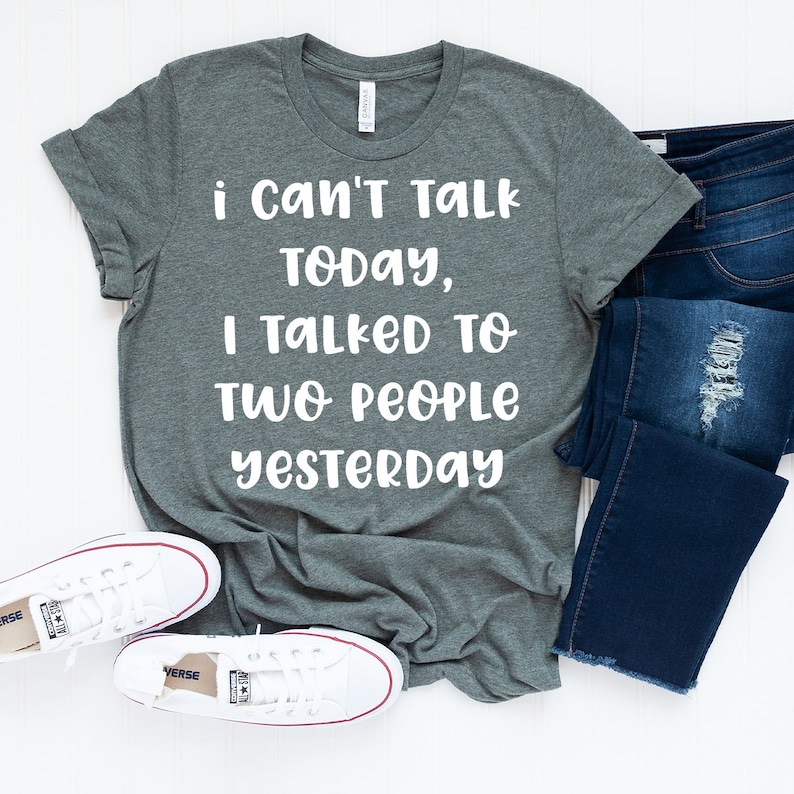 May include: A heather gray t-shirt with the text "i Can't Talk TODAY, I TALKED TO TWO PEOPLE YESTERDAY" printed in white.