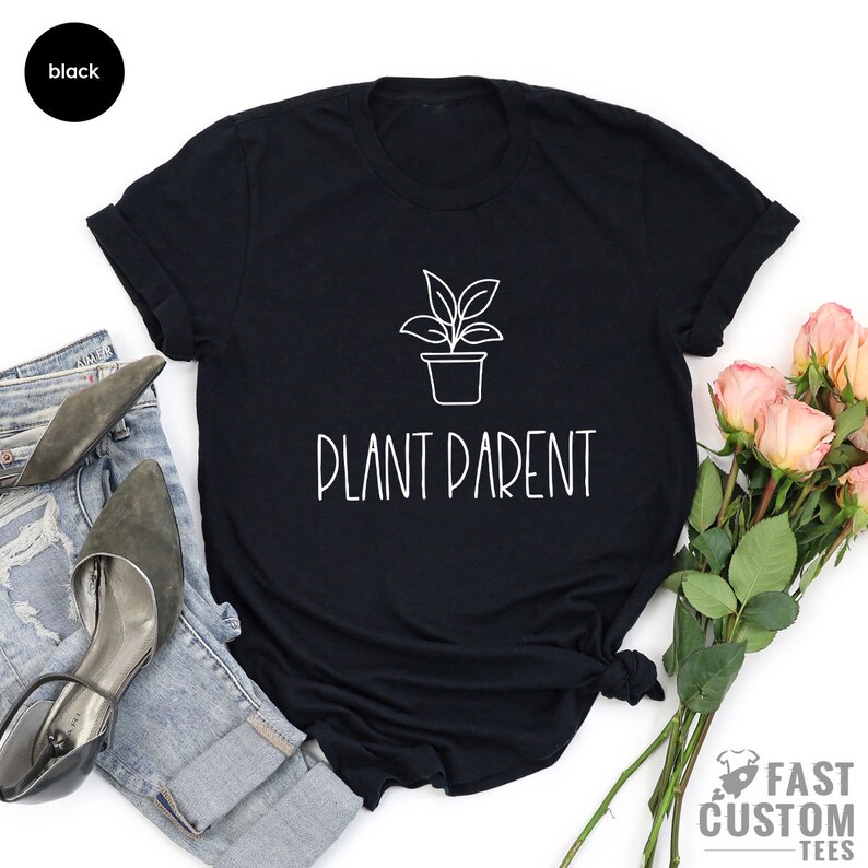 May include: Black t-shirt with a white outline of a potted plant and the text "Plant Parent".