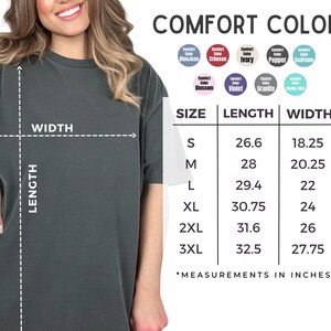 a woman wearing a grey t-shirt, with a table of measurements and a list of comfort colors displayed next to her.