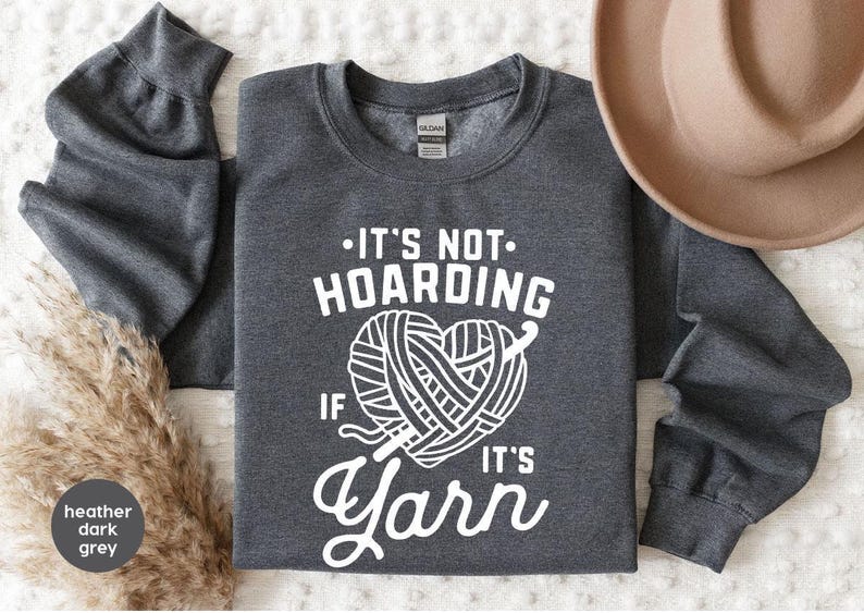a gray shirt that says it's not hoarding if it's yarn